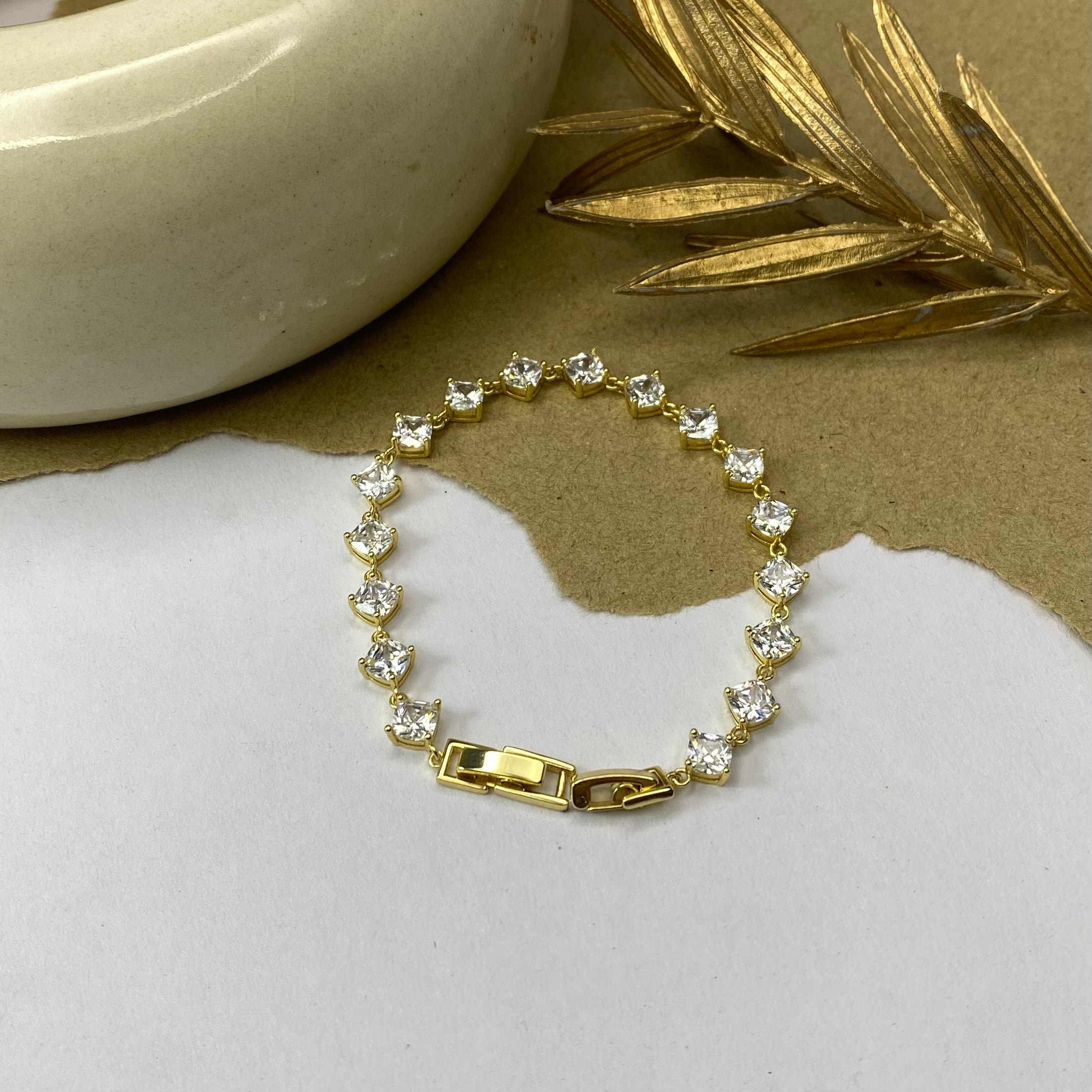 Golden Tennis Bracelet with Solitaire Stones