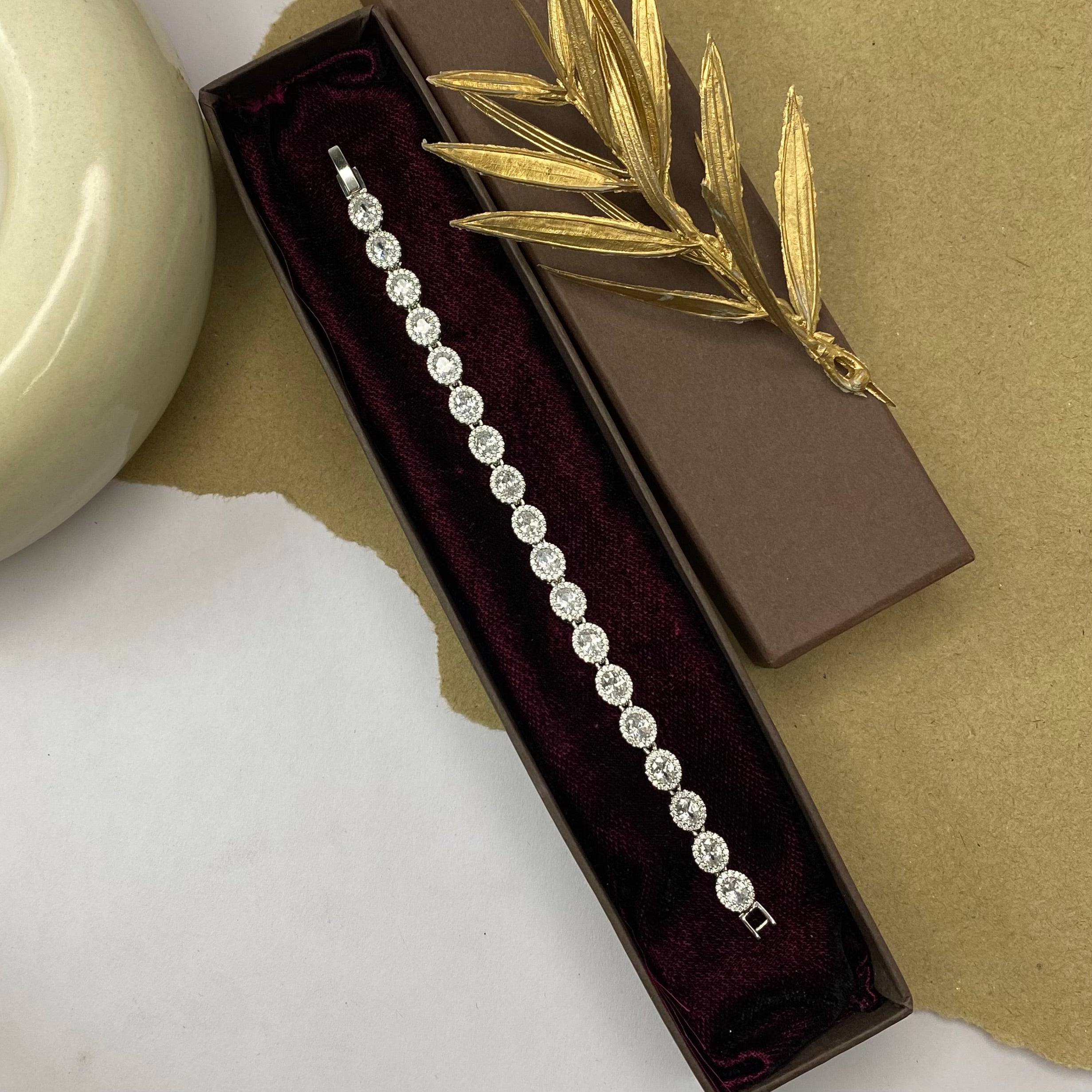 Golden Tennis Bracelet with Solitaire Stones