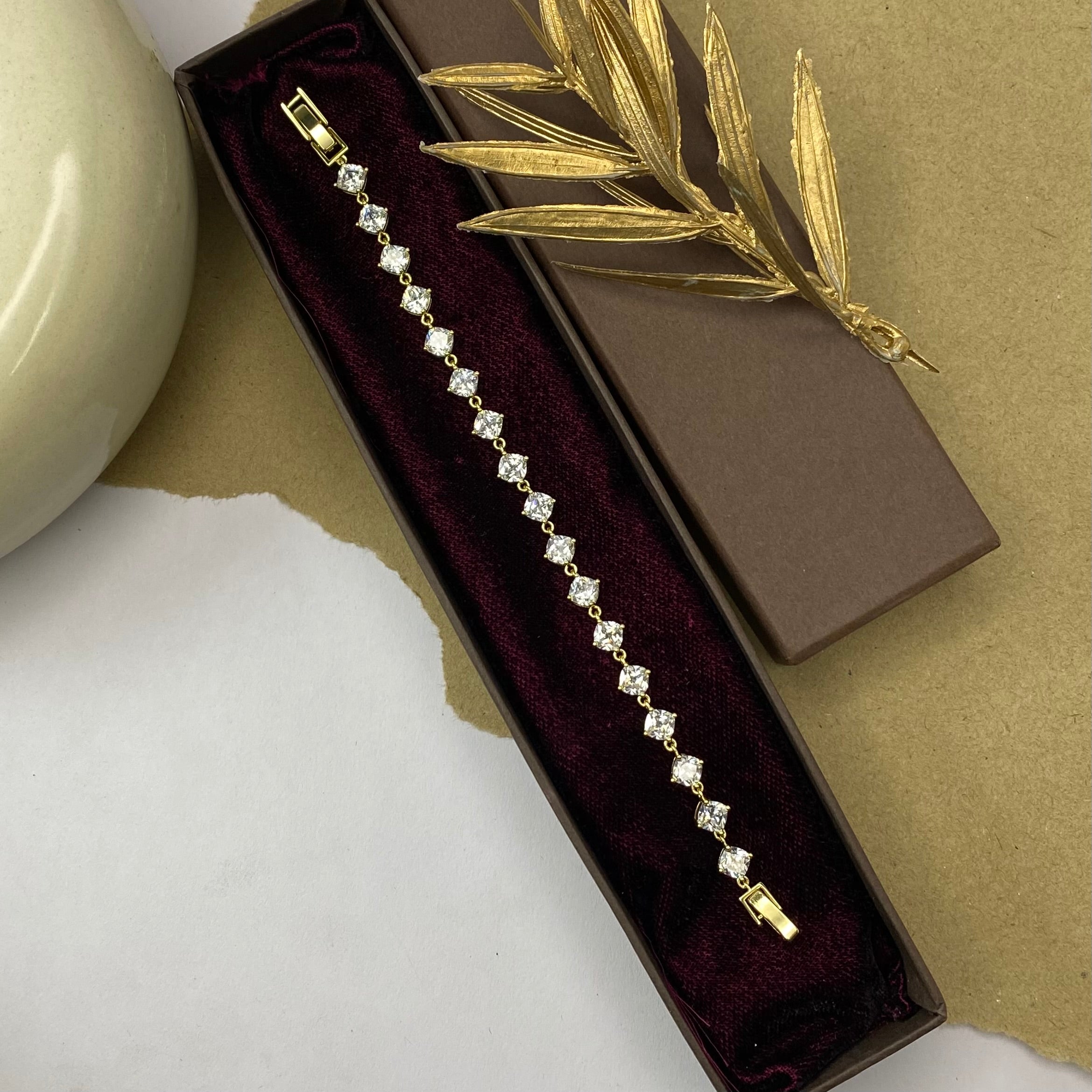 Golden Tennis Bracelet with Solitaire Stones